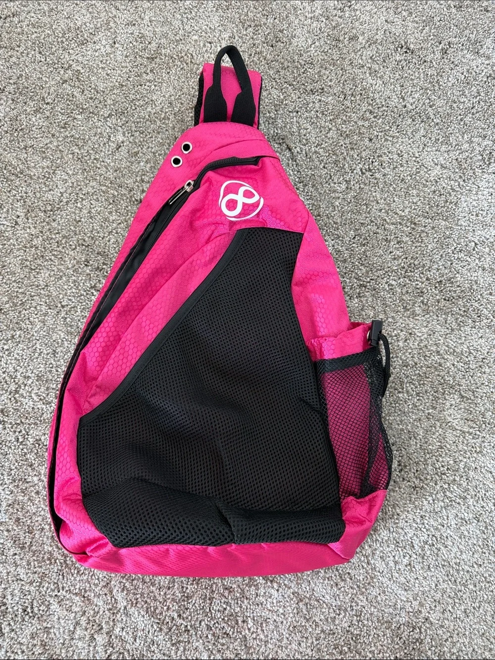 Bright Pink Sling Backpack with Black Mesh Pocket